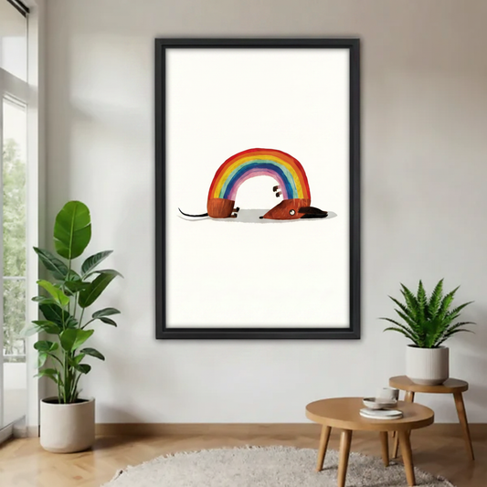 Funny rainbow dachshund minimalist framed canvas wall art – black frame, brown dachshund arched into rainbow shape on white background, hung in bright Scandinavian living room with cream sofa and tropical plant