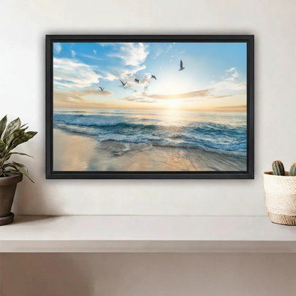 Ocean sunrise beach framed canvas wall art with golden light and seagulls above coastal shelf decor