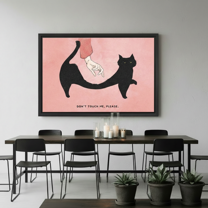 Don't Touch Me Please black cat canvas print in black floating frame above a dark dining table in a modern room