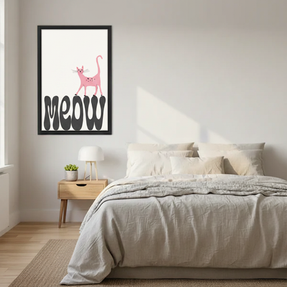 Minimalist pink cat meow wall art print in black frame above Scandinavian bed with linen bedding and oak nightstand with white lamp in modern bedroom