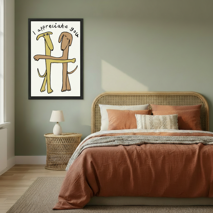  Funny dogs hugging "I Appreciate You" framed wall art, black frame, whimsical cartoon illustration on cream background, styled beside a rattan headboard bed in a warm sage green boho bedroom with terracotta bedding