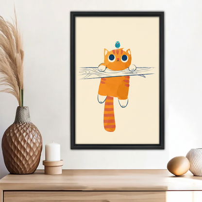 Funny orange tabby cat hanging from branch with blue bird on head wall art print in black frame above wooden sideboard with pineapple vase and white candle in boho living room
