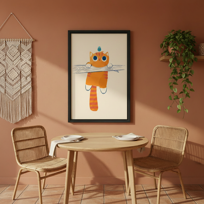 Whimsical orange tabby cat hanging on branch blue bird perched on head funny wall art print in black frame on terracotta wall above rattan dining table and chairs with trailing ivy in boho dining room
