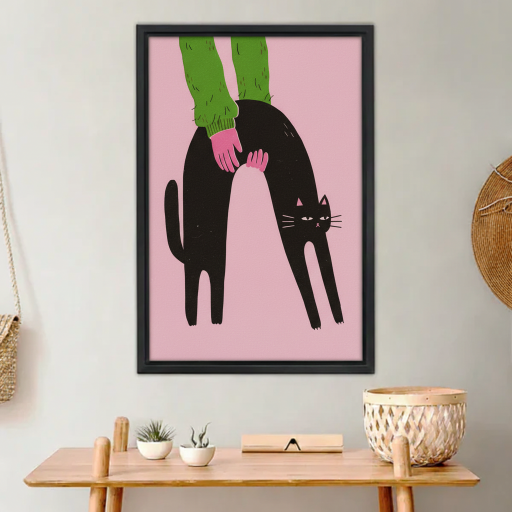 Funny black cat arching back being petted green sweater pink background wall art print in black frame above wooden entryway bench with succulents in boho hallway