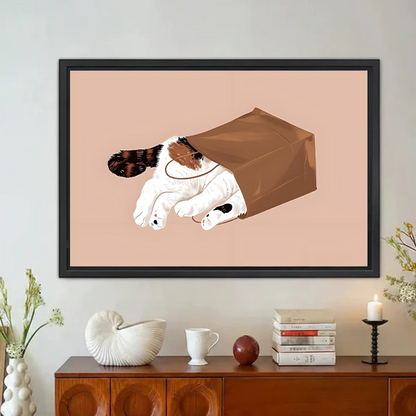 Playful cat in paper bag minimalist framed canvas print blush pink background displayed in cozy home decor setting