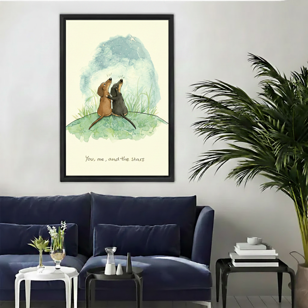 Two dachshunds you me and the stars watercolor romantic wall art print in black frame above navy velvet sofa with black coffee table and palm plant in modern living room