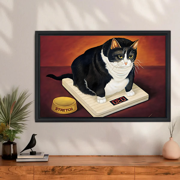 Black framed funny cat wall art of tuxedo cat on scale in sideboard setting