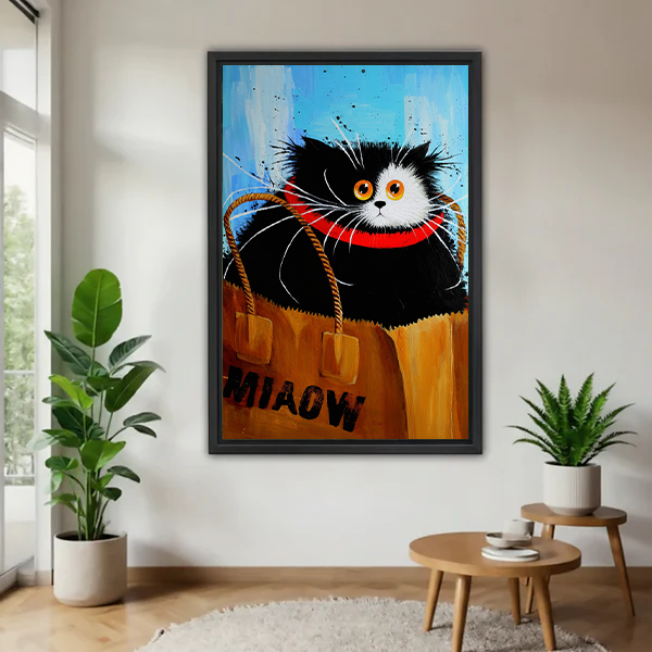 Black and white cat with orange eyes and red collar sitting inside MIAOW kraft paper shopping bag bold oil painting style framed wall art hung on white wall in Scandinavian living room with large fiddle leaf fig plant and round wooden side table