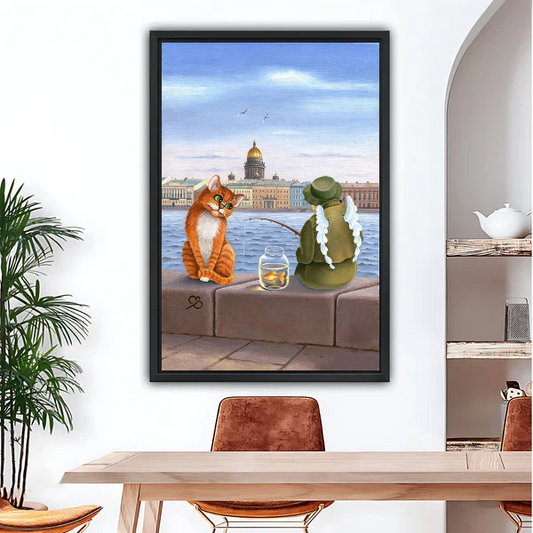 Cat and frog fishing storybook canvas print in black frame hanging in cozy dining room with wooden furniture