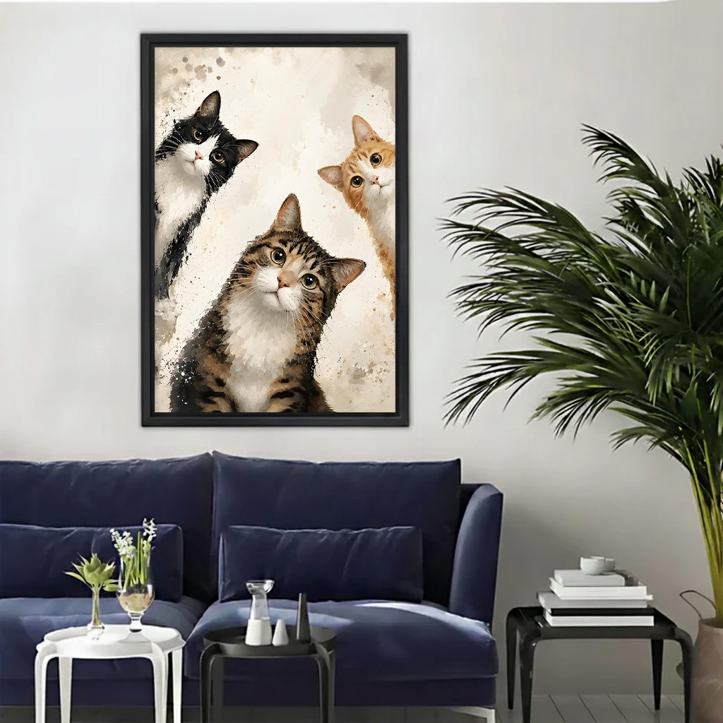 Framed whimsical watercolor cat portrait wall art print in black frame above a blue sofa