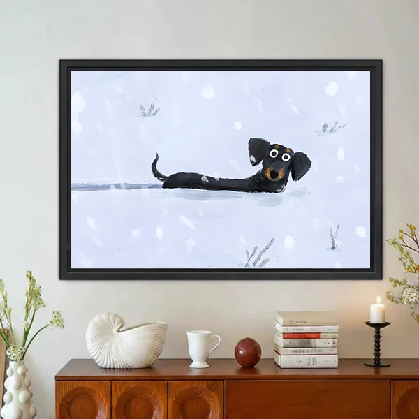 Snow Day dachshund whimsical framed wall art with cartoon wiener dog in snow displayed above wooden sideboard