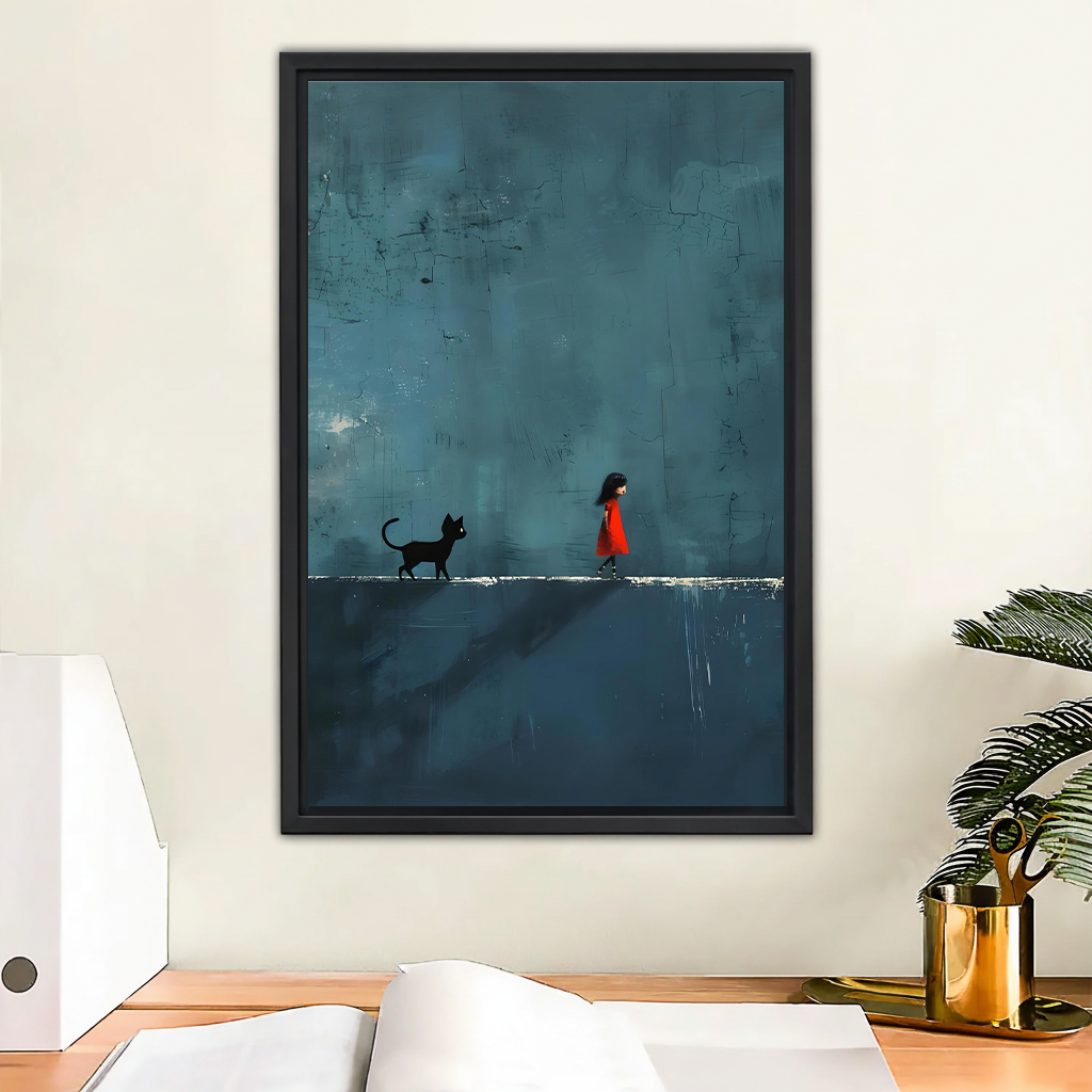 Dark moody wall art print in black frame above wooden desk – girl in red dress walking with black cat on deep teal painterly background in home office