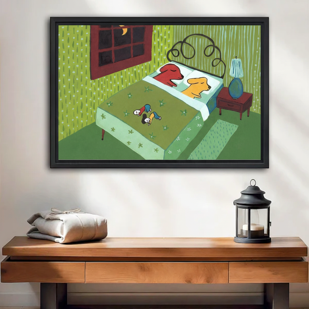 Whimsical dogs stole the bed framed canvas wall art, red and yellow dogs sleeping in bed, two tiny people at foot, moonlit retro green bedroom illustration, black frame, hung above wooden console table with lantern