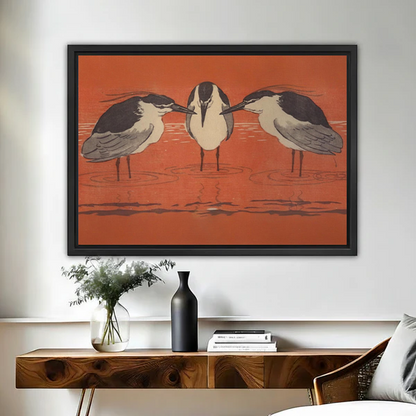 Framed Japanese woodblock three herons rust red wall art print above wooden console table with vase