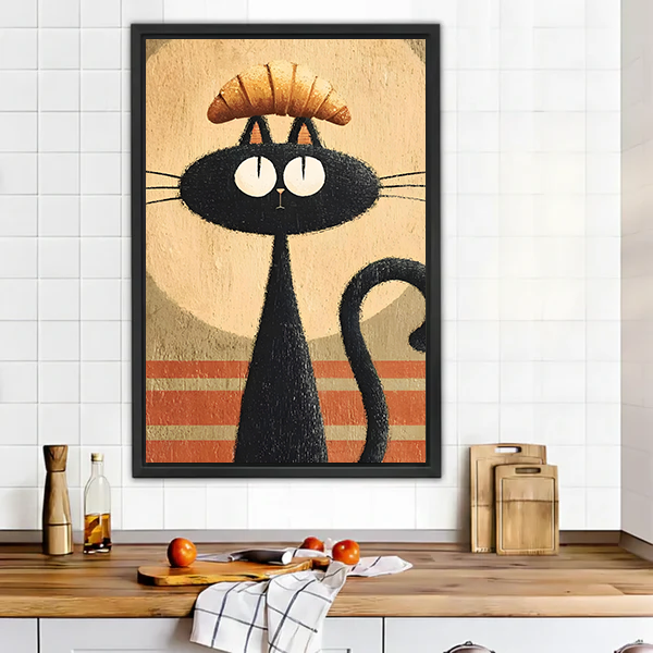 Funny black cat croissant retro framed wall art in black frame above rustic wooden kitchen counter