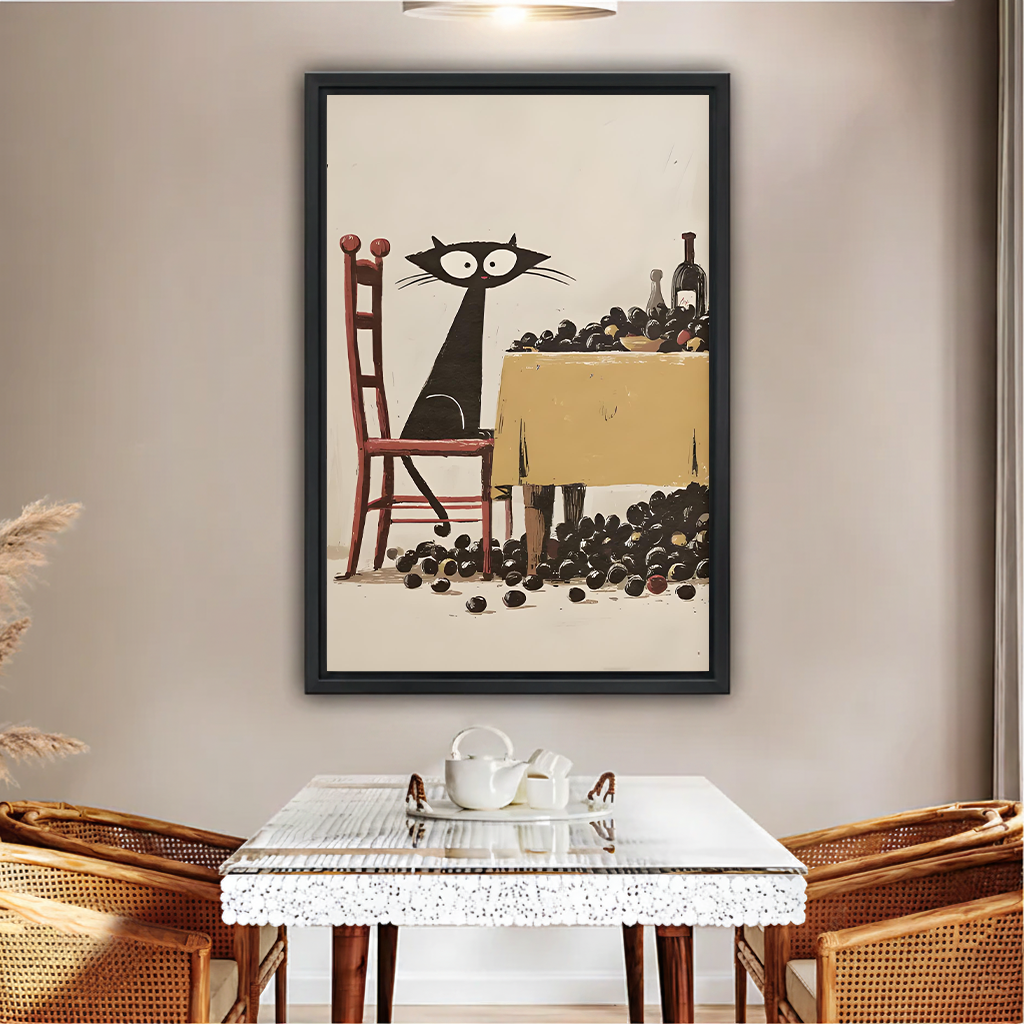 Vintage black cat and grapes framed wall art in black frame above rattan dining table