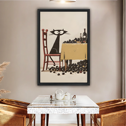 Vintage black cat and grapes framed wall art in black frame above rattan dining table