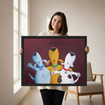 Smiling woman holding whimsical three dogs best friends framed canvas print, colorful cartoon dog wall art, black frame, bright modern living room