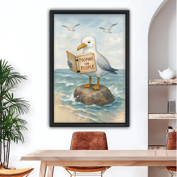 Funny seagull reading book framed wall art print hanging in dining room above wooden table