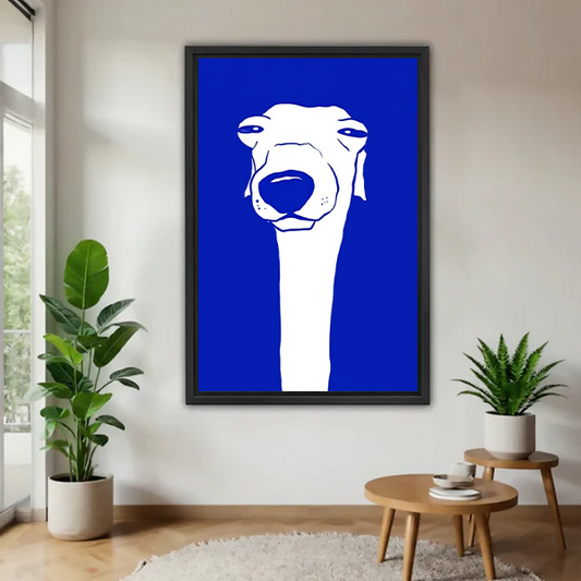 Greyhound bold blue minimalist modern framed canvas wall art in black frame displayed in bright living room with tropical plants and wooden side table