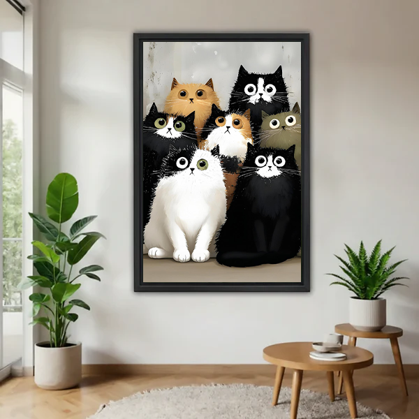 Black-framed seven cats canvas wall art in a bright reading corner with potted plants and small wooden tables.