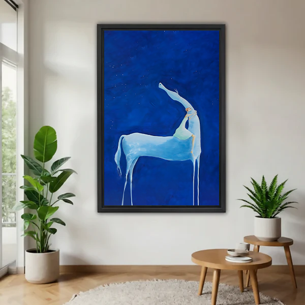 Mystical blue deer wall art in black frame displayed in modern living room