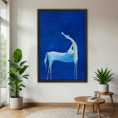 Mystical blue deer wall art in black frame displayed in modern living room