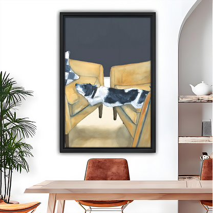 Funny dog modern wall art print in black frame above dining table with dog lounging between two yellow armchairs