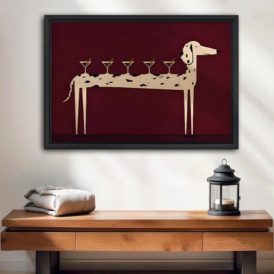 Unframed whimsical martini dog canvas wall art with a burgundy background above a wooden console and lantern.