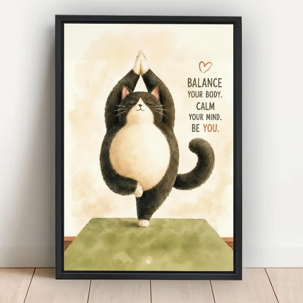 Cute yoga cat "Balance Your Body Calm Your Mind Be You" framed wall art in black frame leaning on white wall