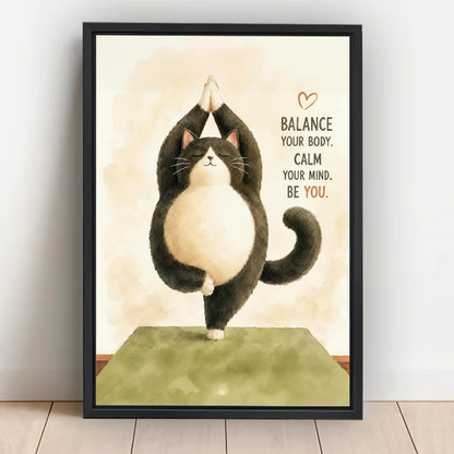 Cute yoga cat "Balance Your Body Calm Your Mind Be You" framed wall art in black frame leaning on white wall