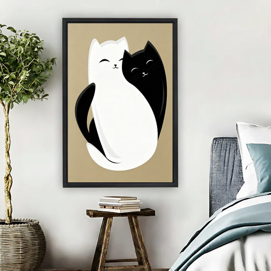 Cute black and white cat yin yang wall art print in black frame beside bed with wooden stool and wicker basket in cozy boho bedroom