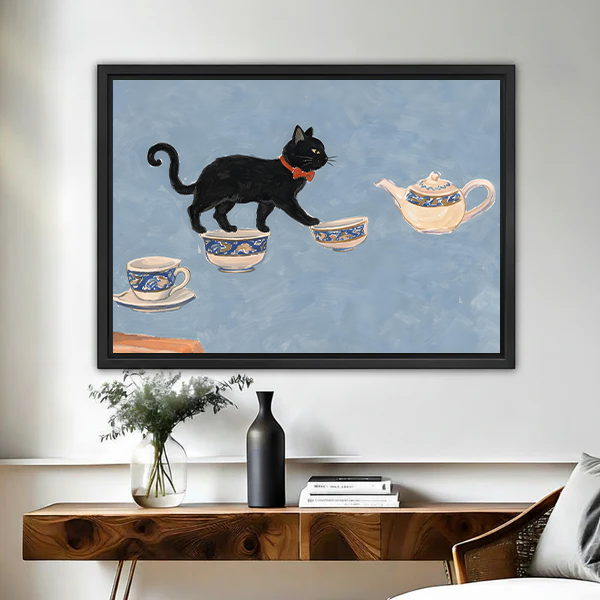 Framed black cat tea party wall art print hanging above wooden console table