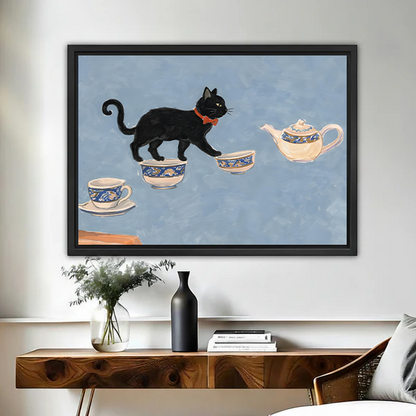 Framed black cat tea party wall art print hanging above wooden console table