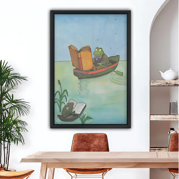 Reading frog watercolor framed wall art print hanging in modern dining room above wooden table
