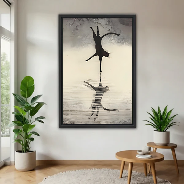 Black framed cat reflection wall art print hanging in a bright living room with indoor plants, minimalist ink animal decor