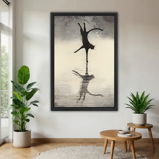 Black framed cat reflection wall art print hanging in a bright living room with indoor plants, minimalist ink animal decor