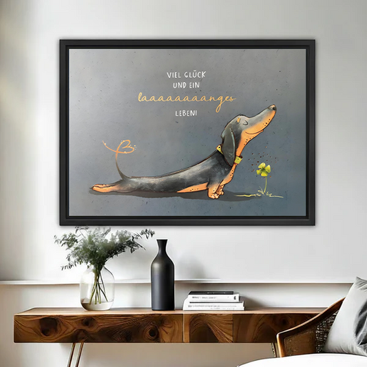 Funny dachshund watercolor wall art in black frame above wooden console table with vases