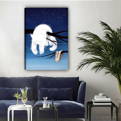 White cat on branch melting clock surreal starry night gallery wrap canvas art displayed above navy blue sofa with palm plant in contemporary living room