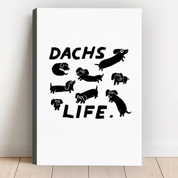 Dachs Life dachshund gallery wrap canvas art with bold black wiener dog pattern leaning against white wall