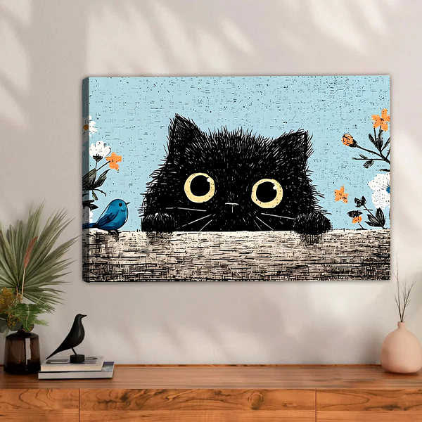 Fluffy black cat peeking over wall with blue bird and wildflowers vintage illustration gallery wrap canvas art displayed above wooden sideboard with palm plant and pink vase