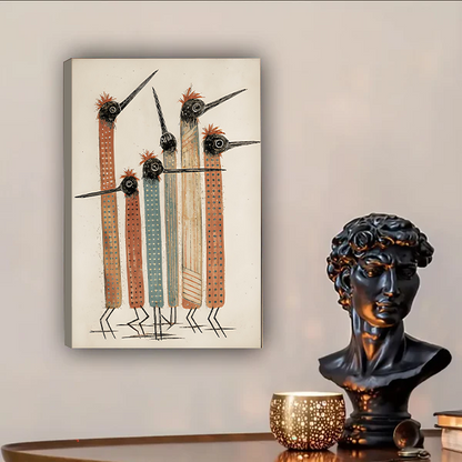 Five tall abstract tribal birds with red fluffy crests long pointed beaks striped terracotta and grey-blue bodies with dot texture patterns folk art hand-drawn illustration on aged cream background gallery wrap canvas art displayed on warm grey wall above dark walnut wooden sideboard with black David bust sculpture gold perforated candle holder and stacked books