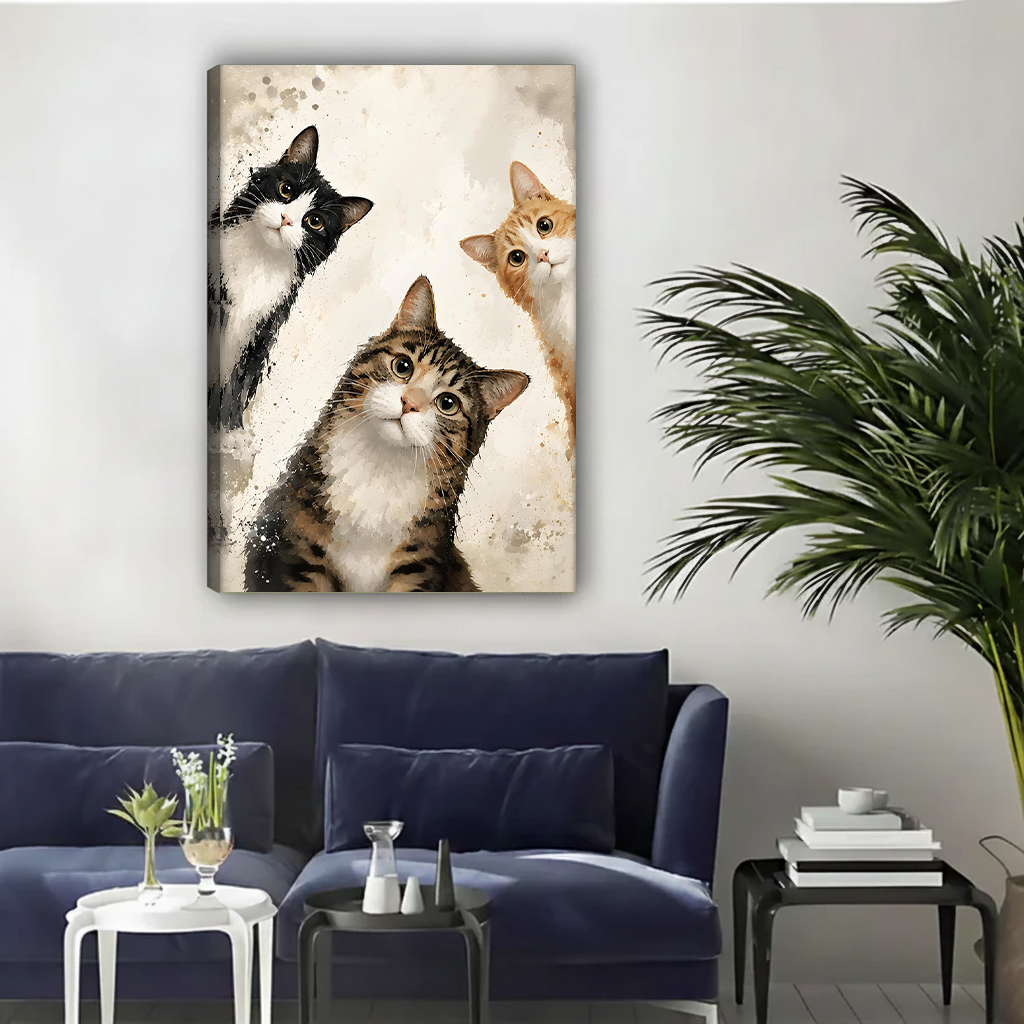 Three curious cats watercolor canvas wall art displayed in a contemporary living room above a navy sofa