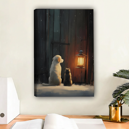 Dog and cat winter night lantern gallery wrap canvas art with warm amber glow displayed above wooden desk with gold accessories in modern workspace