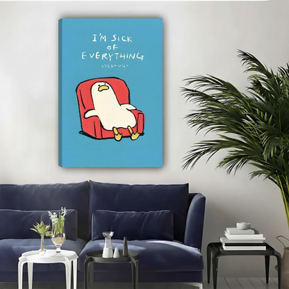 White cartoon duck slouched in red armchair with I'm sick of everything handwritten text on blue background funny minimalist illustration gallery wrap canvas art displayed on white wall above navy blue sofa with white side table glass vase stacked books and large palm plant