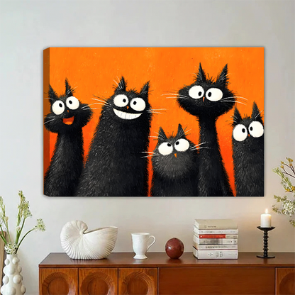 Five fluffy black cats with big white eyes laughing and staring on bold orange background pop art oil painting style gallery wrap canvas art displayed on grey wall above vintage walnut sideboard with white ceramic decor stacked books and black candle holder