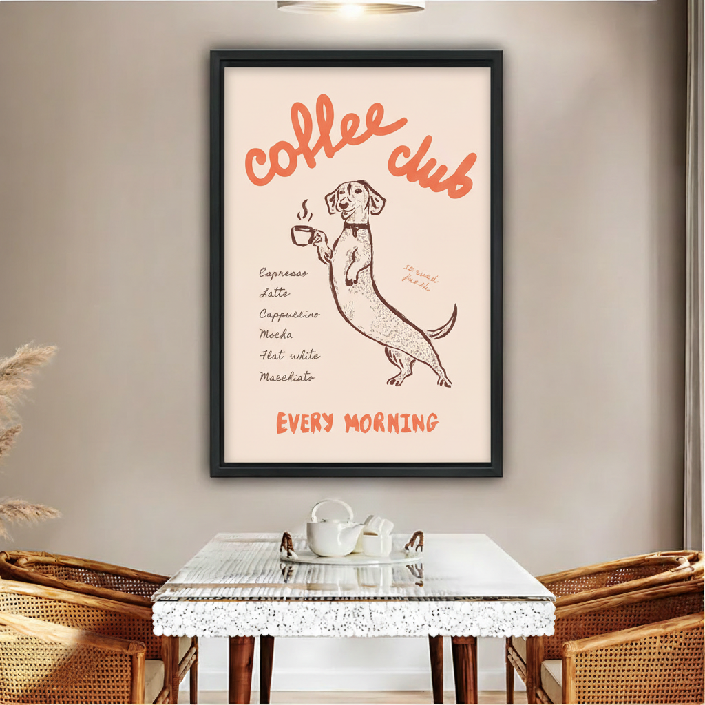Dachshund coffee club every morning retro poster wall art print in black frame above glass dining table with rattan chairs white tea set and pampas grass in boho dining room