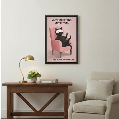 Went outside today very peopley black cat with martini glass wall art print in black frame above rustic wood console table with gold desk lamp in cozy reading nook