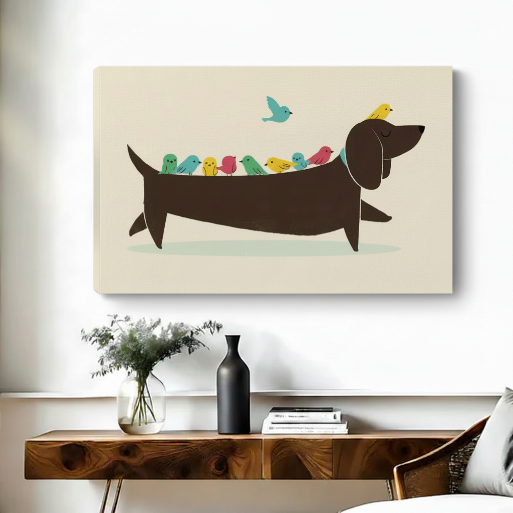 Whimsical sausage dog carrying colorful birds float frame canvas wall art above wooden console table with black vase and stacked books in contemporary hallway