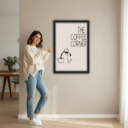 Woman pointing at funny dog the coffee corner humorous minimalist wall art print in black frame showing actual print size on beige wall in bright minimalist entryway with wooden desk and green plant